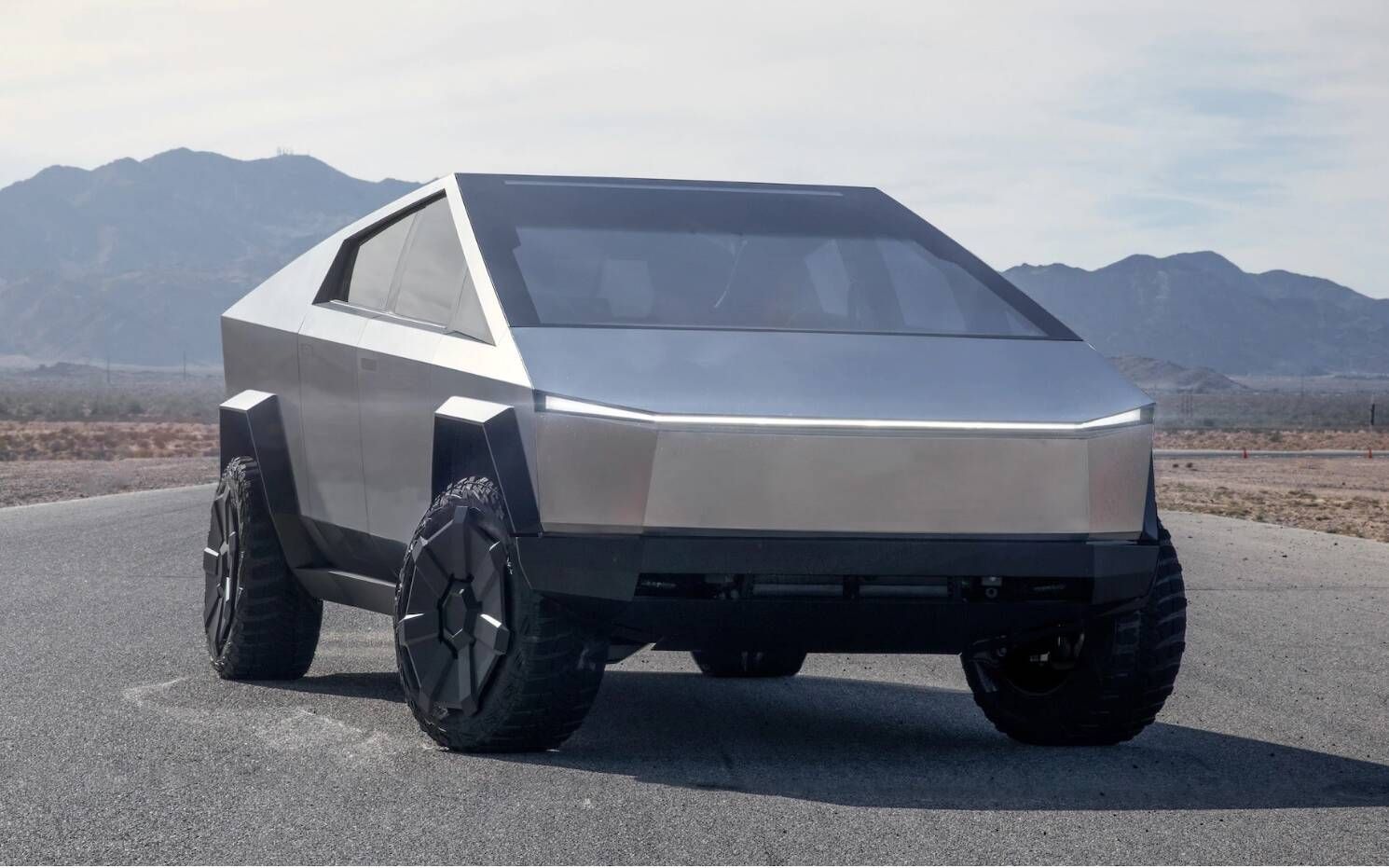 A Tesla Cybertruck, the angular stainless steel electric pickup truck