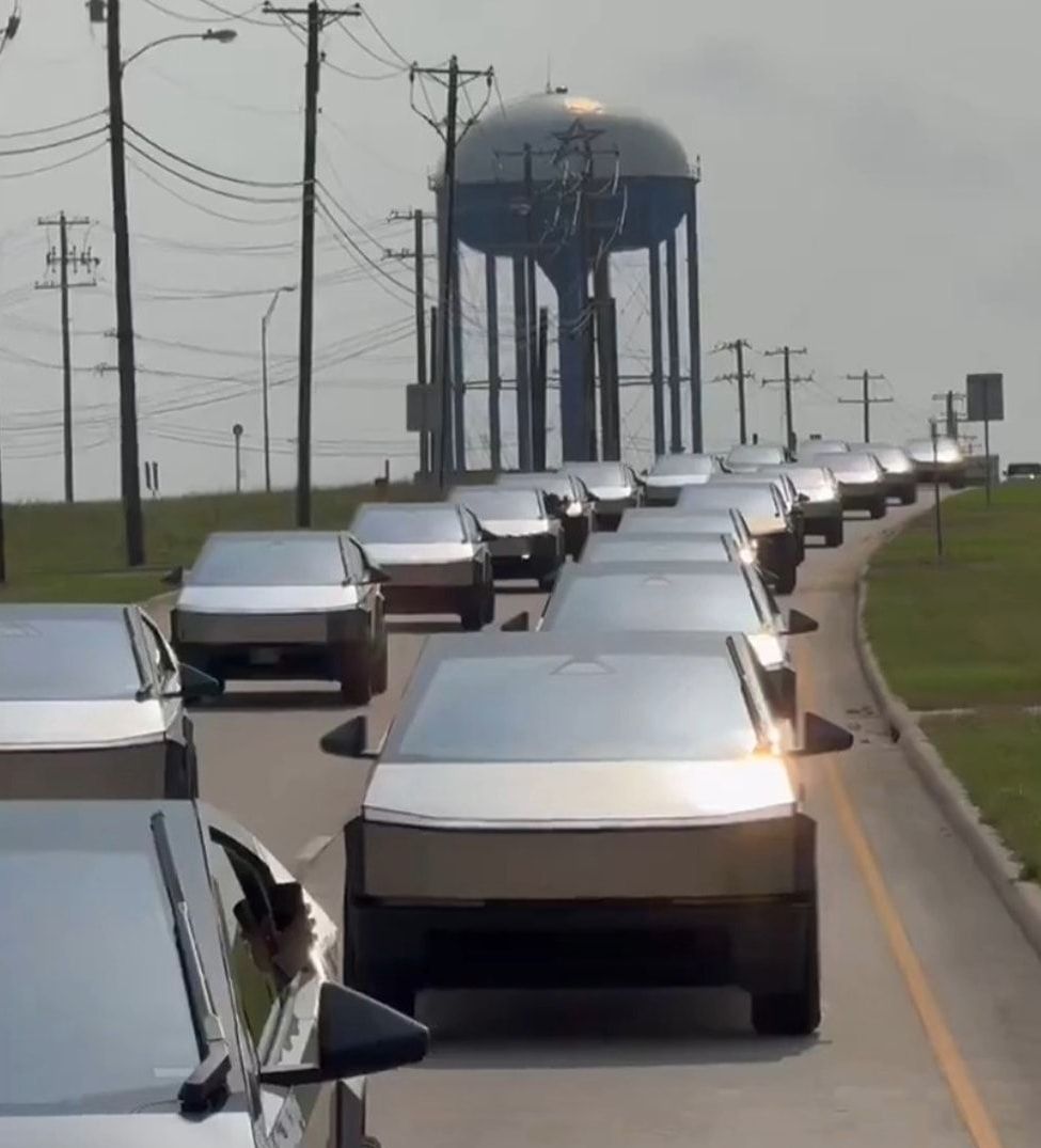 A caravan of Tesla Cybertrucks driving together